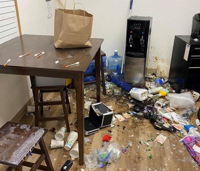 Vandalism during a break in at a Flagstaff, Arizona business. There is food, needles, and emptied cleaning supplies.