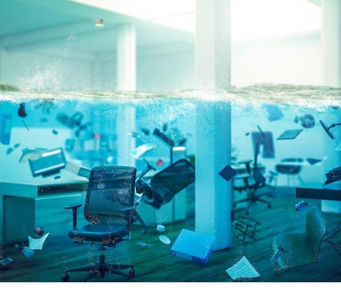 office furniture and supplies submerged under water in an office room